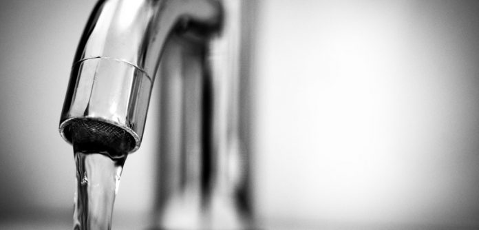 tap faucet close up with water coming out