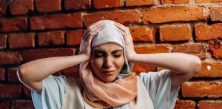 distressed woman wearing hijab
