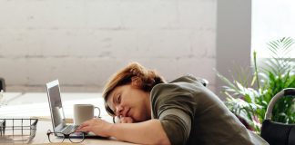 woman sleeping at her desk