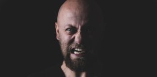 angry bald man with beard