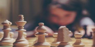 pieces of chess on chessboard