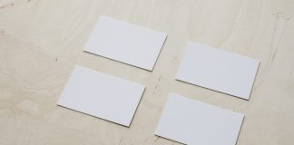 4 plain white cards on table