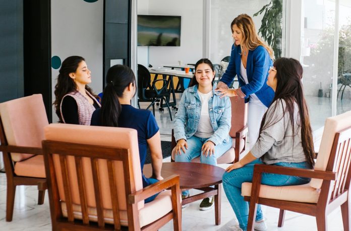 employees at wellbeing meeting