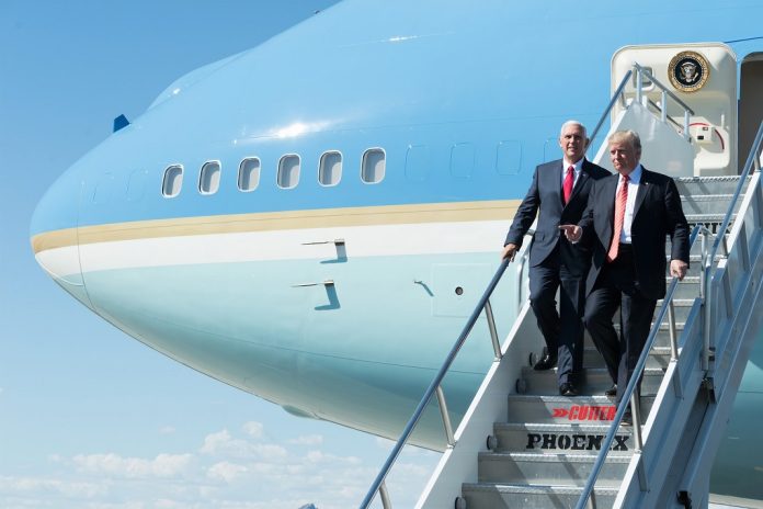 donald trump and mike pence walking down the steps of air force one 1