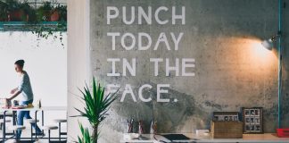 modern contemporary office with "punch today in the face" written on wall
