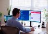 HR professional working at computer