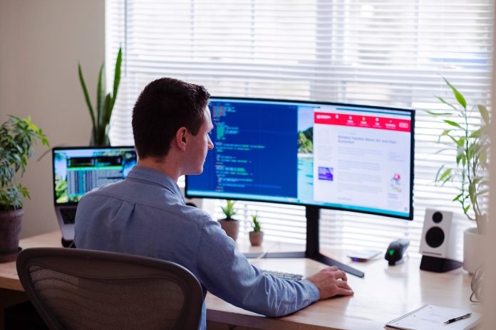 HR professional working at computer