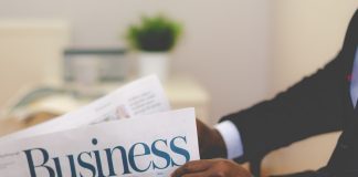 Businessman reading newspaper