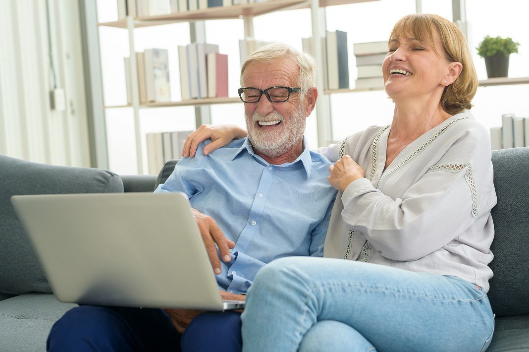 Pensioner viewing laptop
